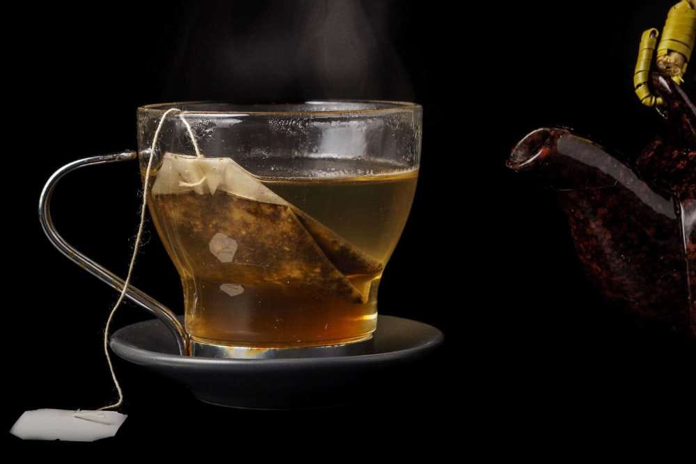 a tea bag steeped in hot water