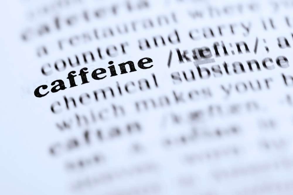 the word caffeine printed on a book