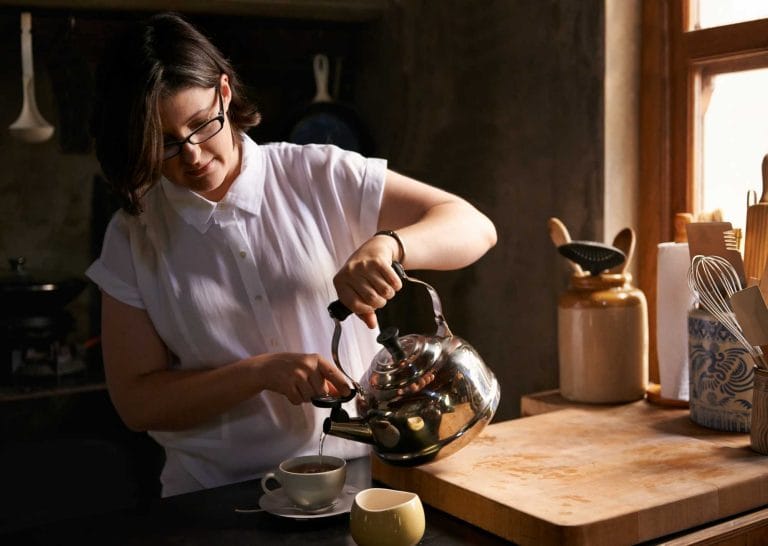 a lady making earl grey tea